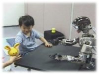 photo: A 4-year-old body checking Infanoid's pointing target