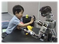 photo: A 4-year-old body touching Infanoid's hand